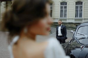 Beautiful retro couple against vintage car